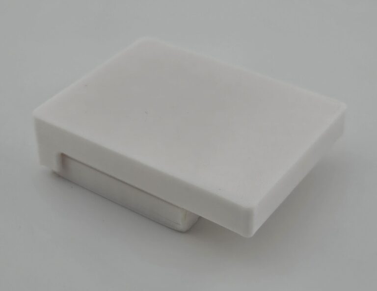 The entire assembly is then picked up so that the powder in the basin can be dumped back into its container, and then the assembly is placed upside-down so that the powder can fall into the caps.