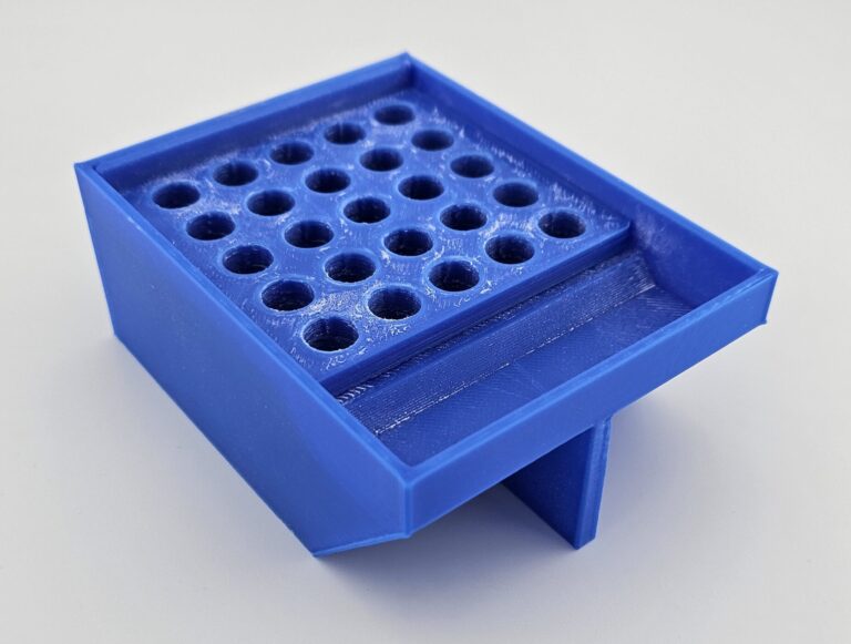 It is placed on top of the main body, aligning the holes